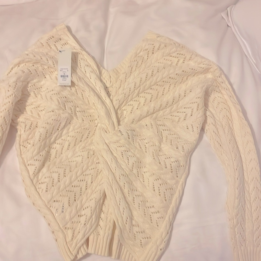 Size xs women’s v neck white sweater with scrunched knot in the back